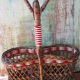 Bottle holder in braided wicker, rattan and scoubidou