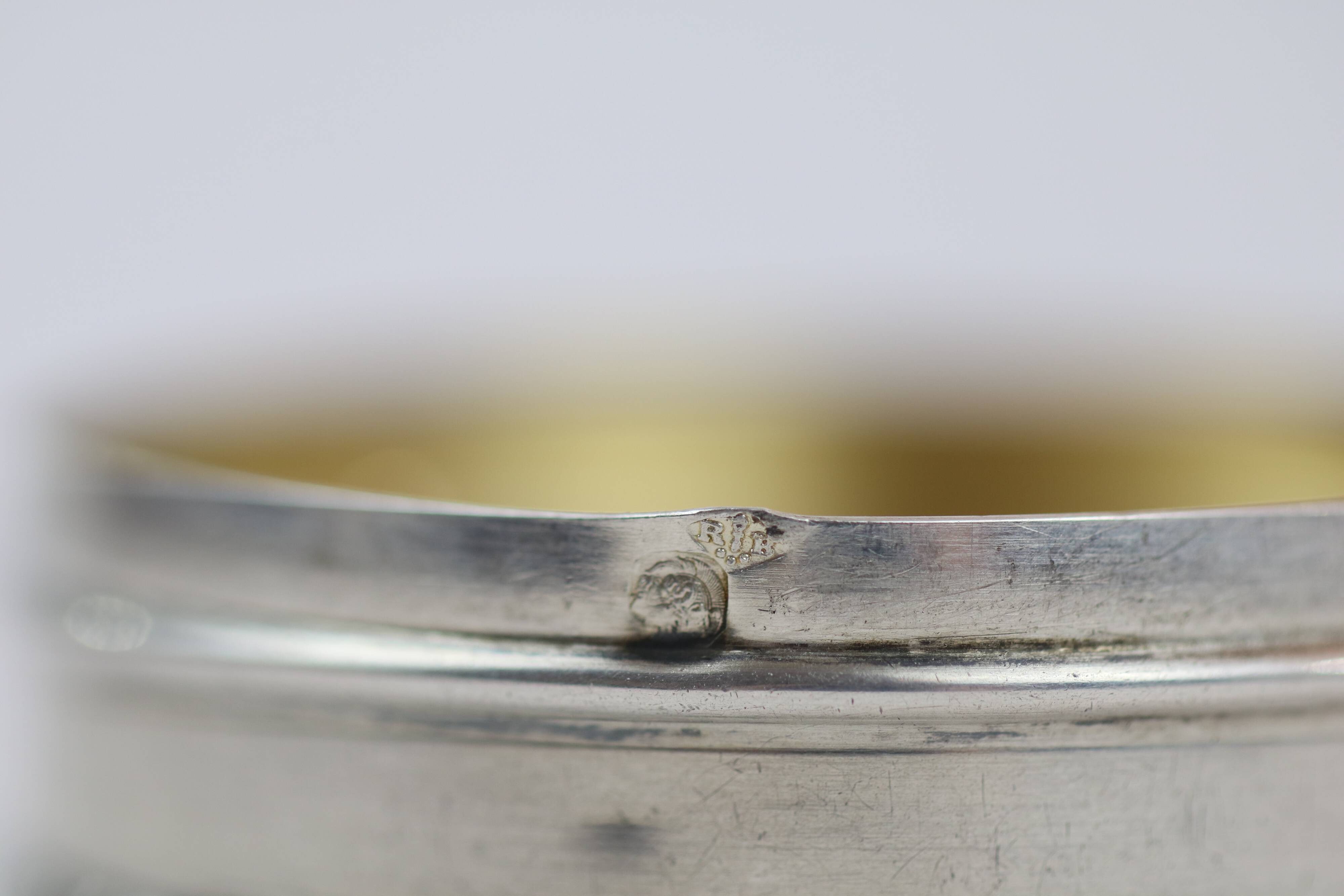 Small round box with silver pills