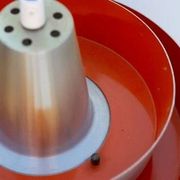 Carl Thore's Trava lamp in aluminium with an orange lacquered interior.