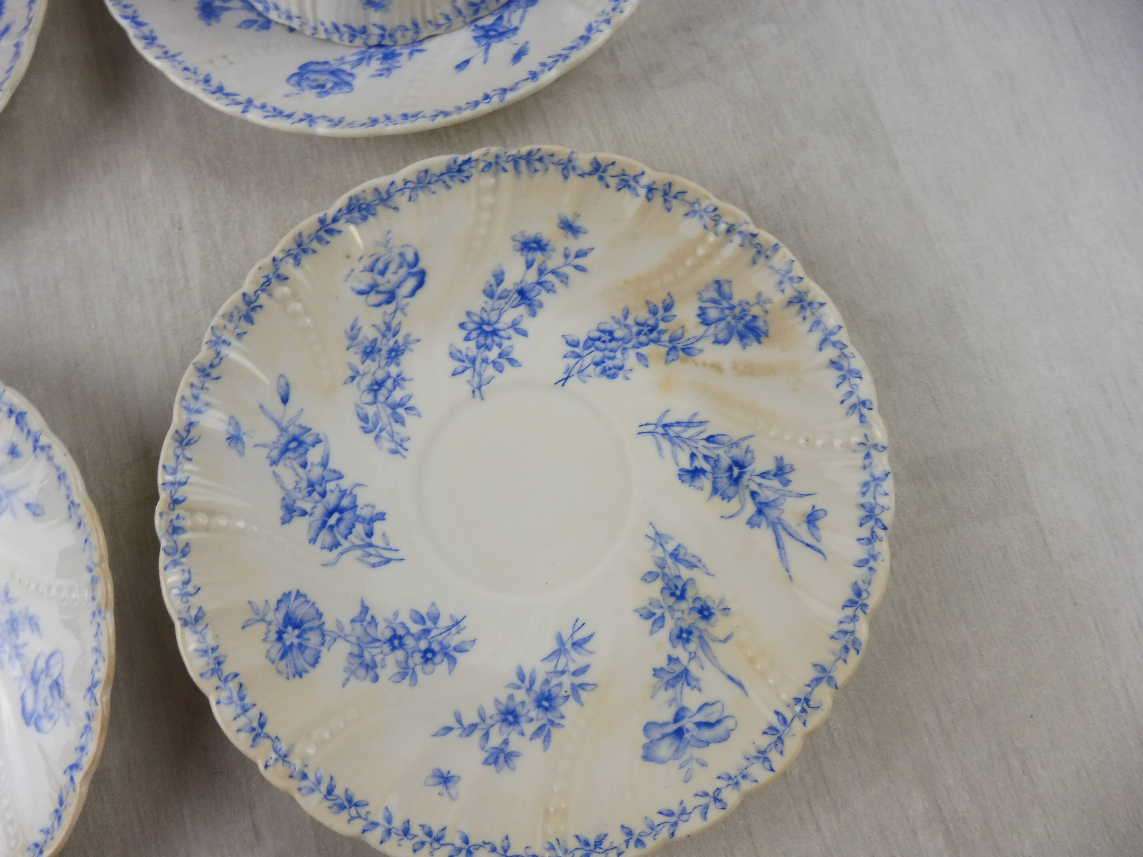 Lot of porcelain cups and under cups, twisted decoration, from Sarreguemines