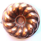 Old copper cake pan, braided crown, kitchen utensil