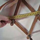 vintage wooden coat rack folds out like an accordion