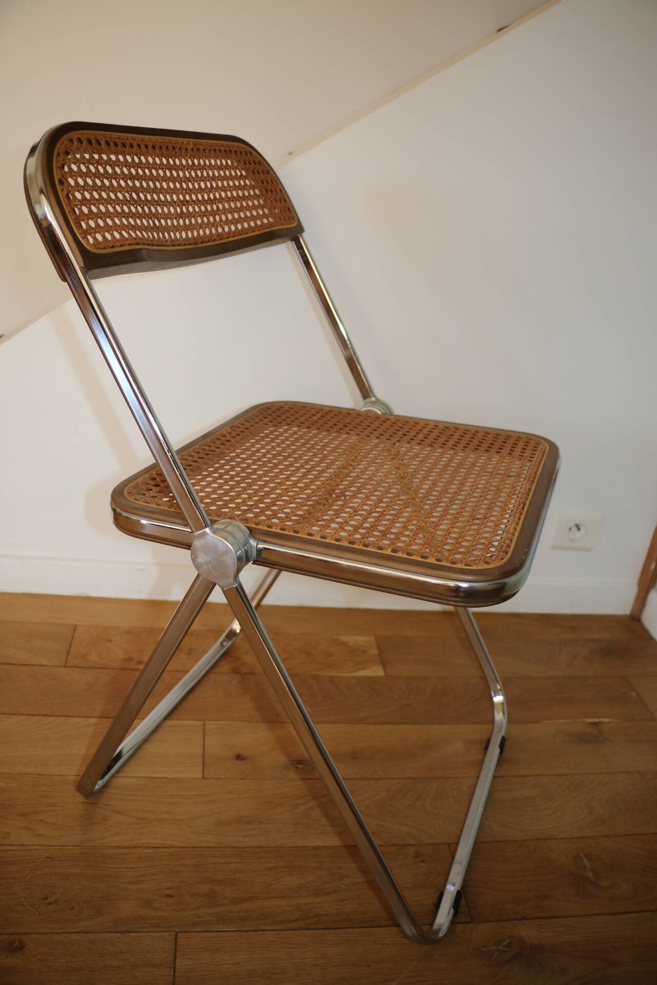 2 plia rattan chairs by piretti