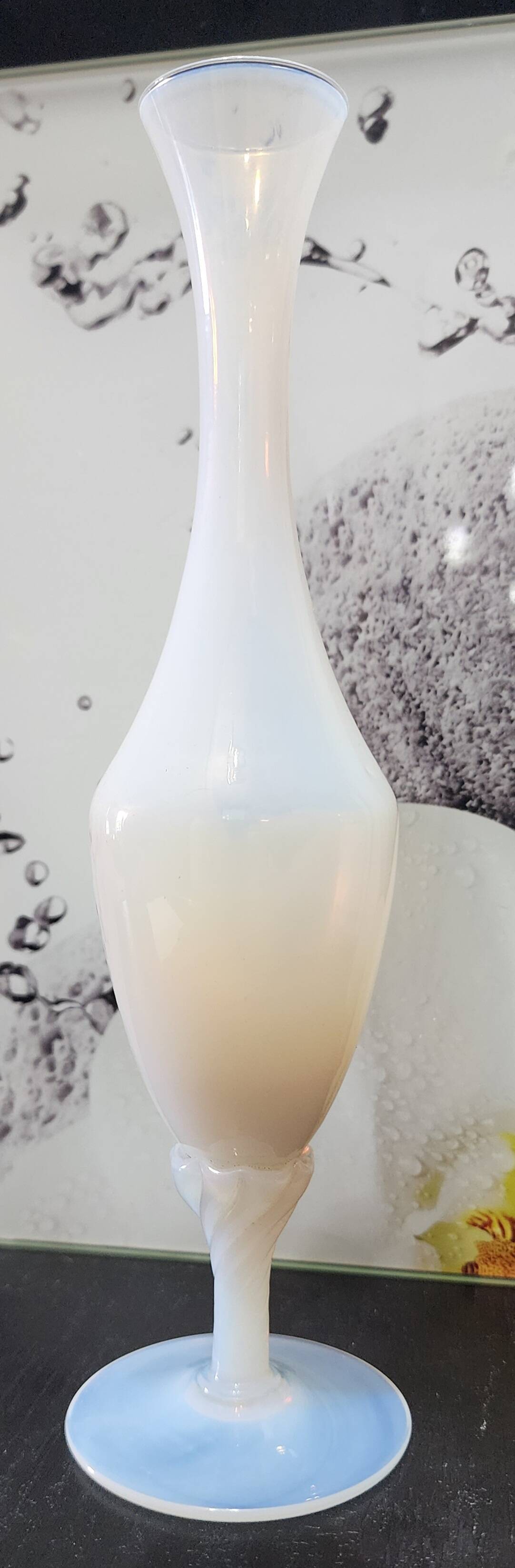 Vintage white opaline soliflore vase with blue reflections and twisted foot.