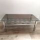 Vintage smoked glass coffee table with chrome legs.