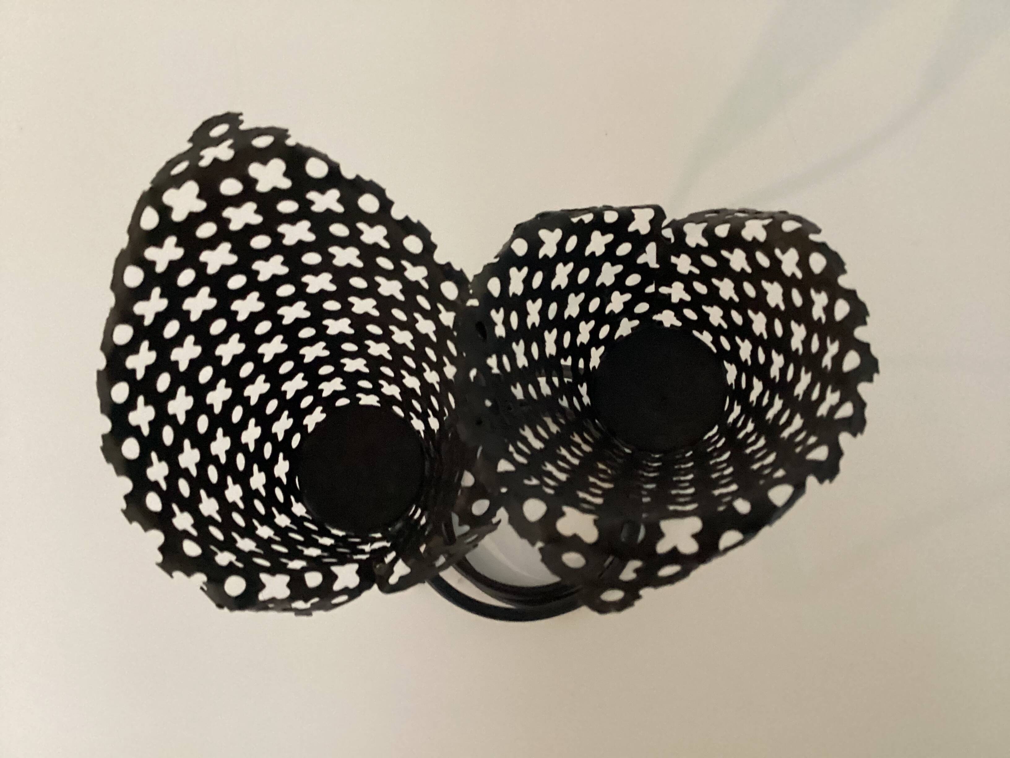 Perforated metal candle holder