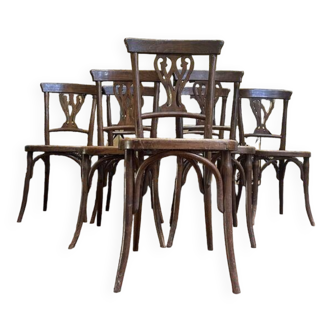 Suite de 7 chaises de bistrot cannées Baumann / Thonet / Fischel