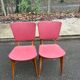 2 Scandinavian chairs in solid wood and burgundy leather from the 1970s.