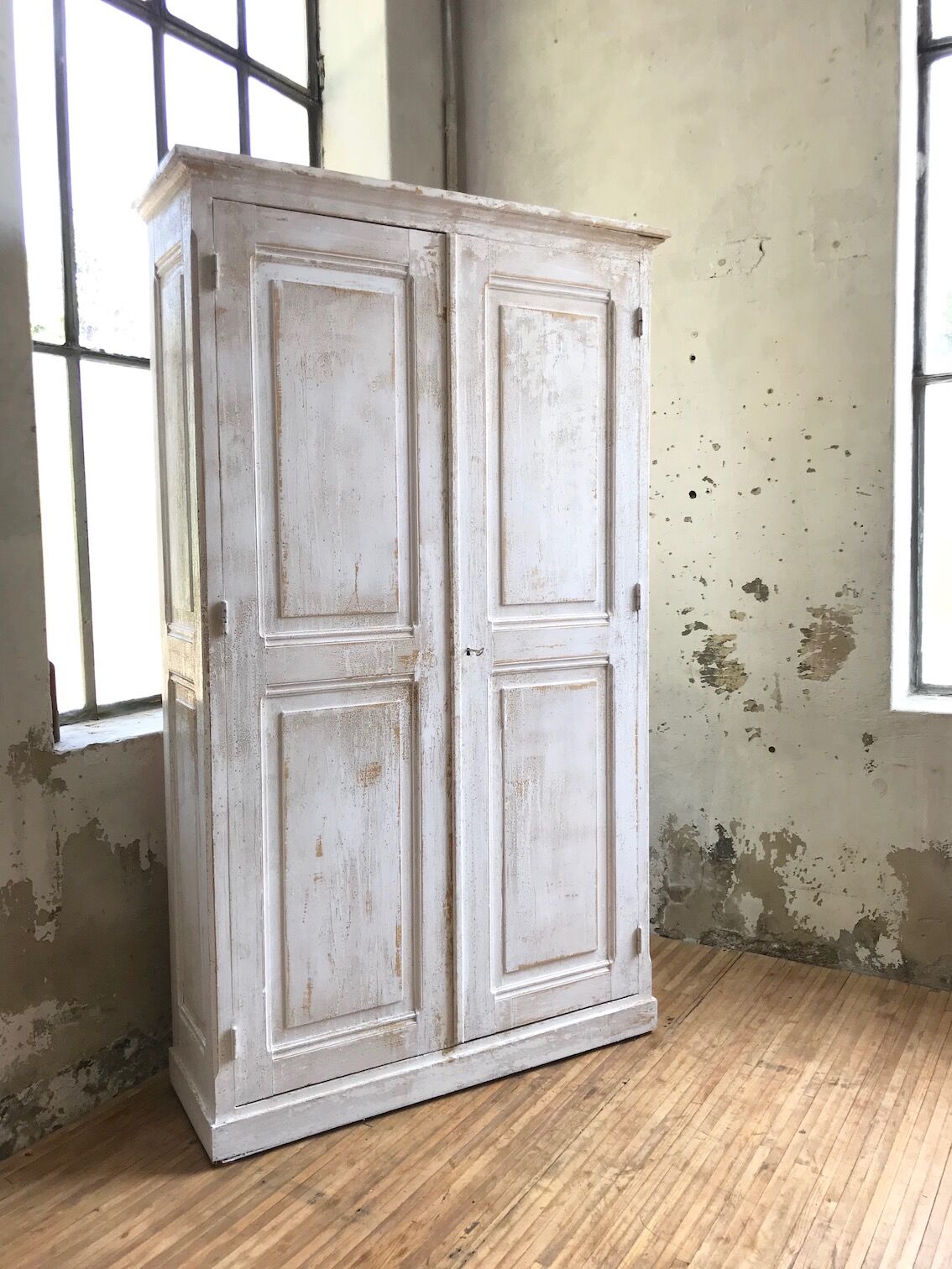 Antique wardrobe in patinated pine