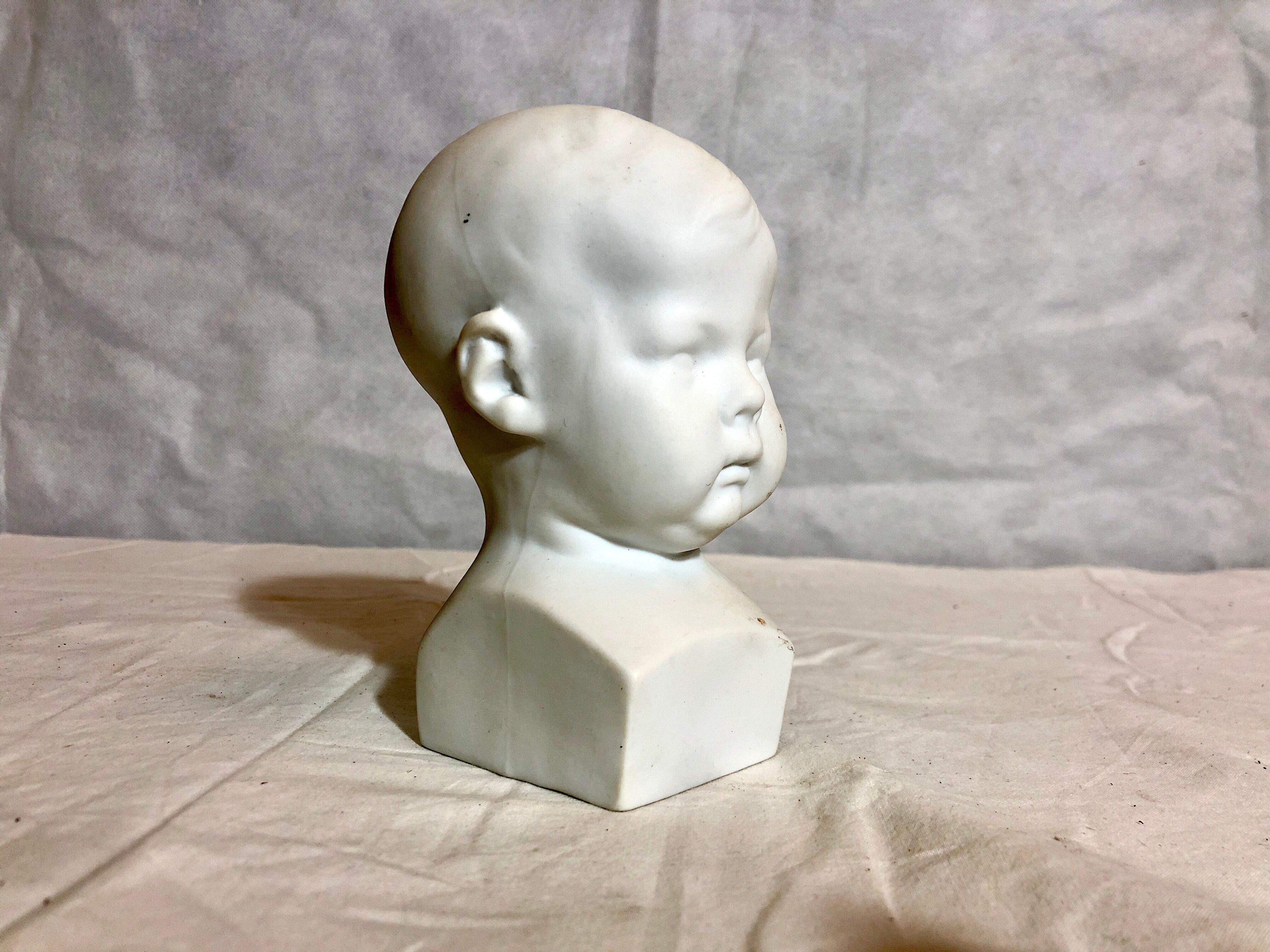 Tête d’enfant en biscuit, XXe siècle