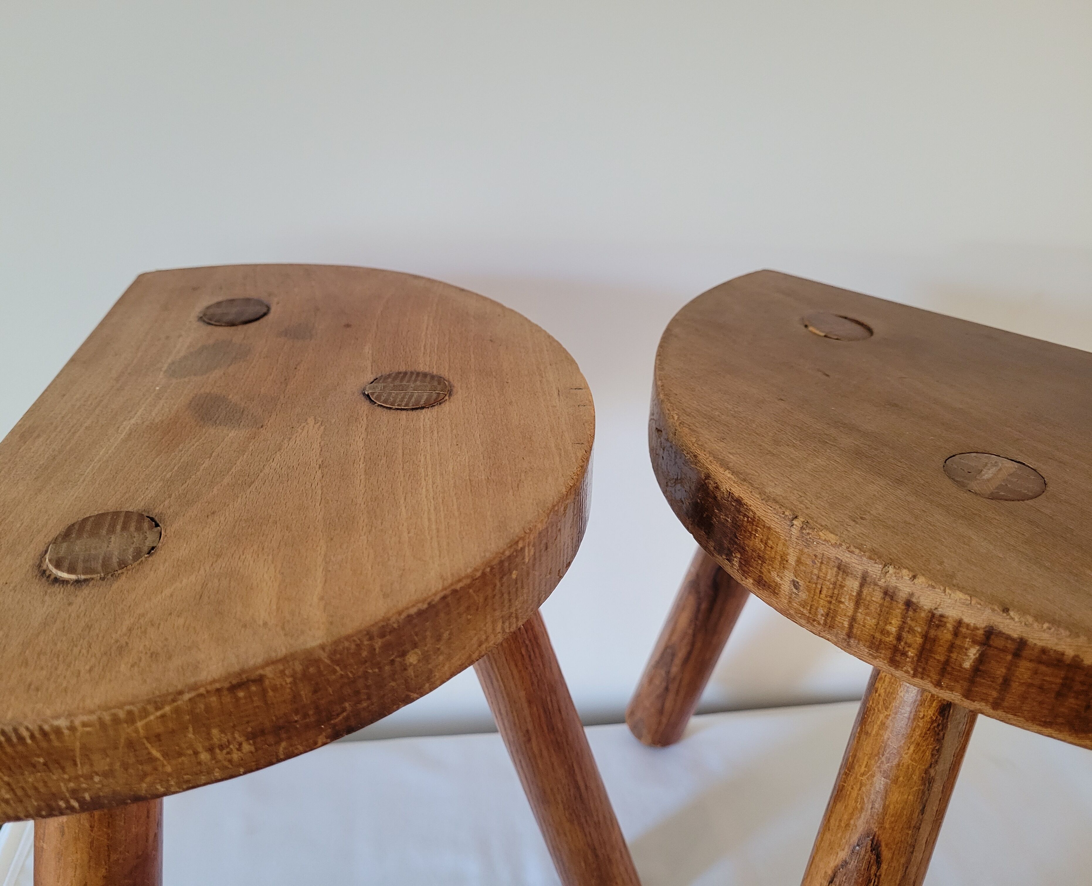 Pair of half-moon tripod stools