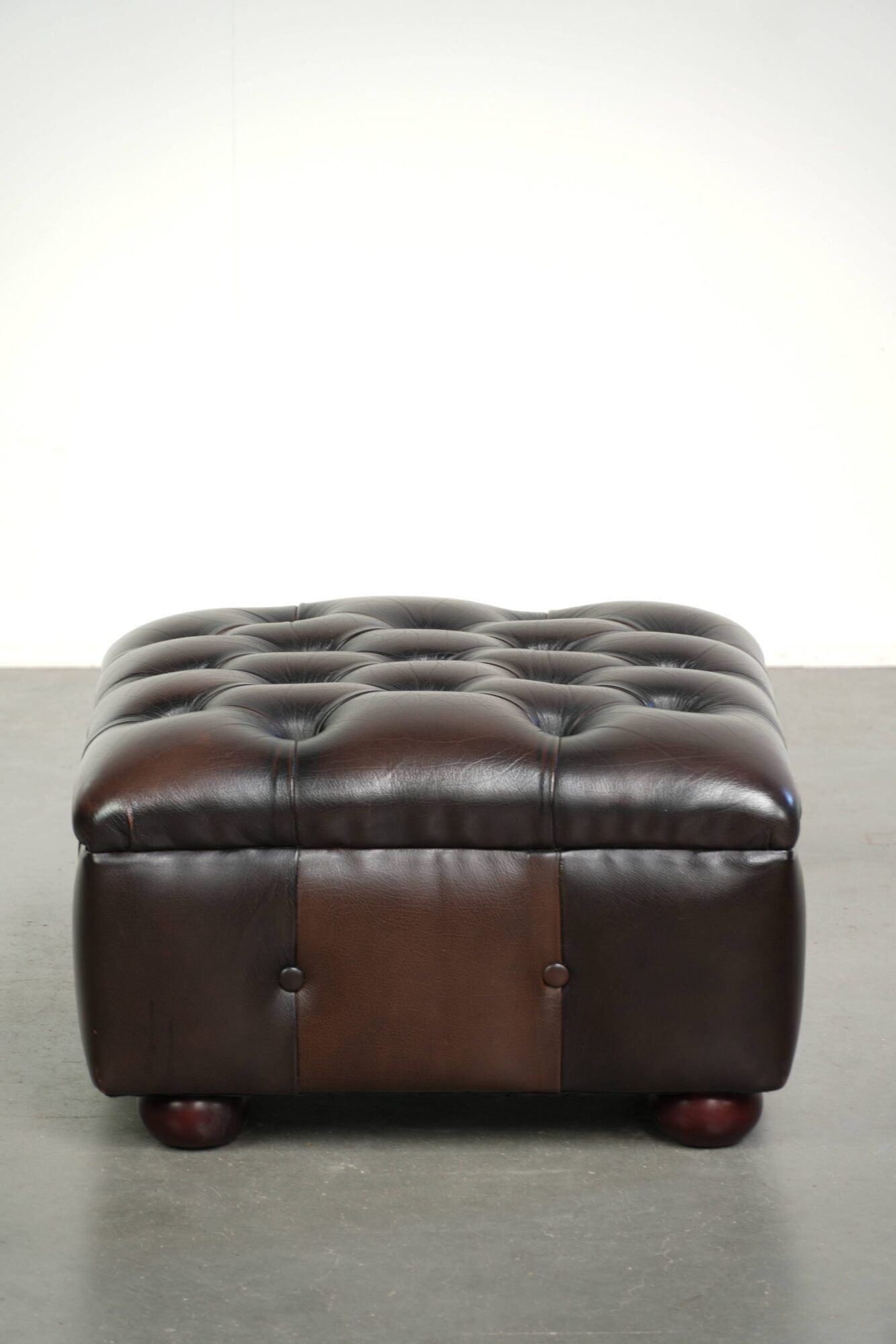 Cowhide Chesterfield ottoman with beautiful colours in English style