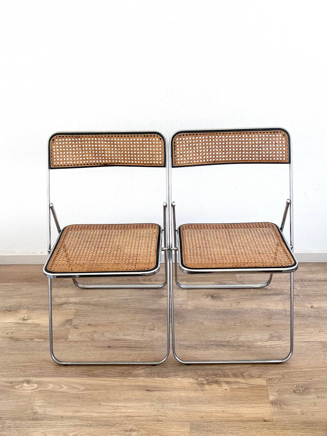 Pair of folding cane chairs