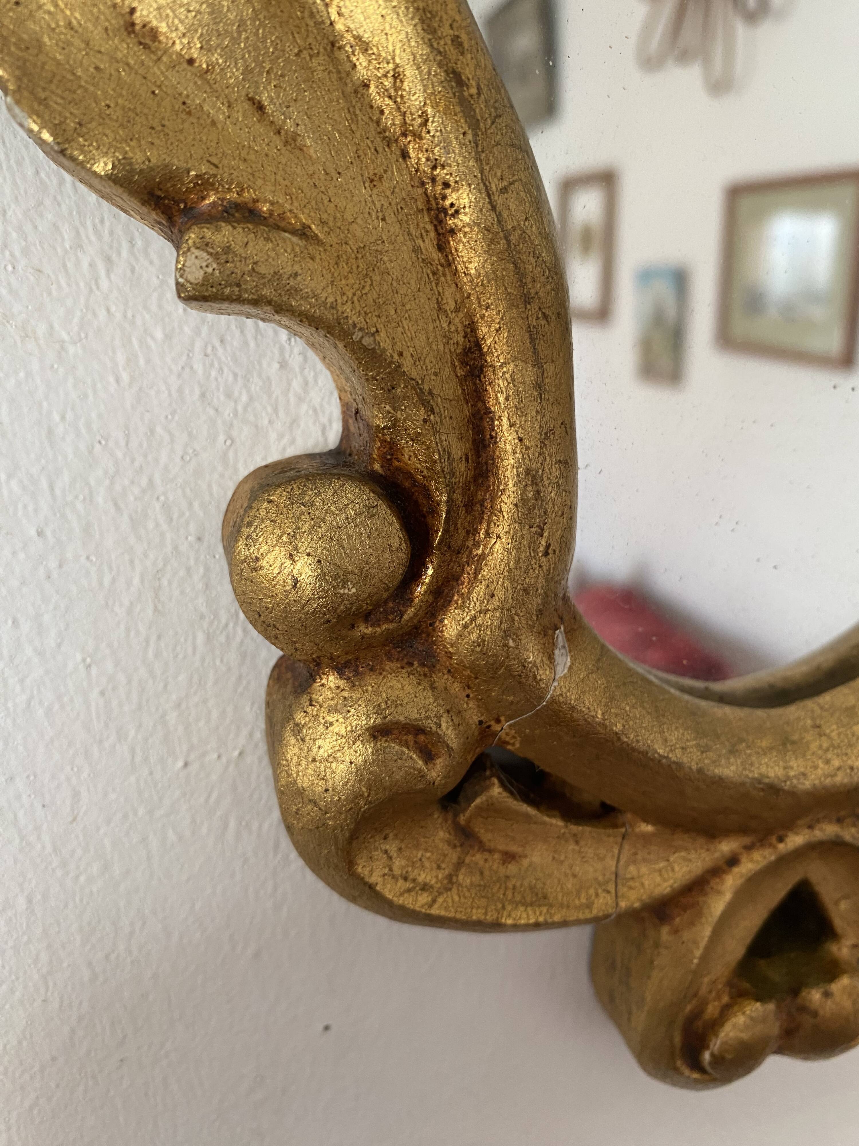 Golden mirror in baroque style.