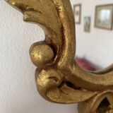 Golden mirror in baroque style.