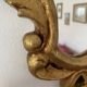 Golden mirror in baroque style.