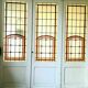 Separation of three doors in 20th century Art Deco stained glass