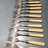 Old silver fish forks with bone handles