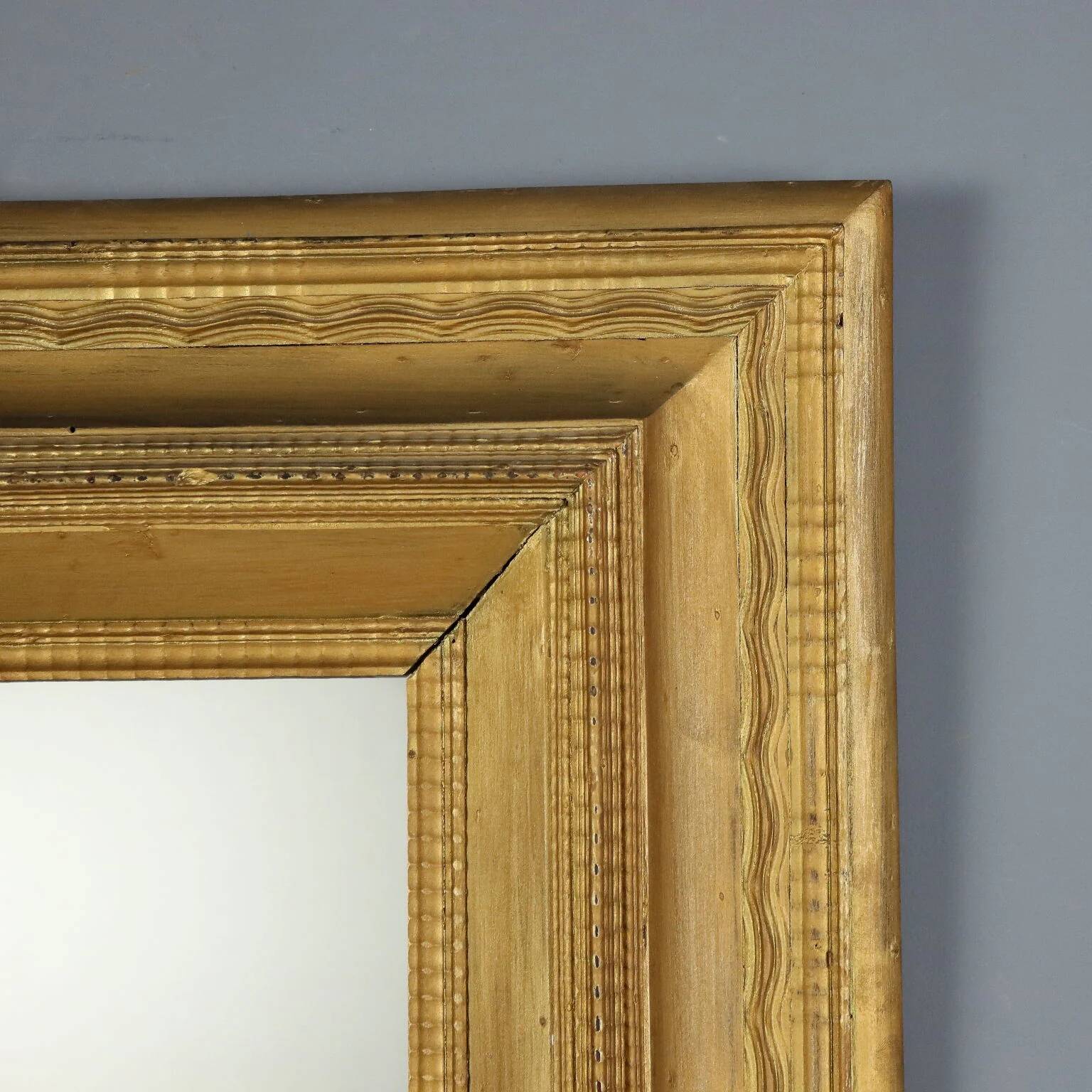 Antique gilded wooden mirror with guilloché frame, Italy, 19th century.