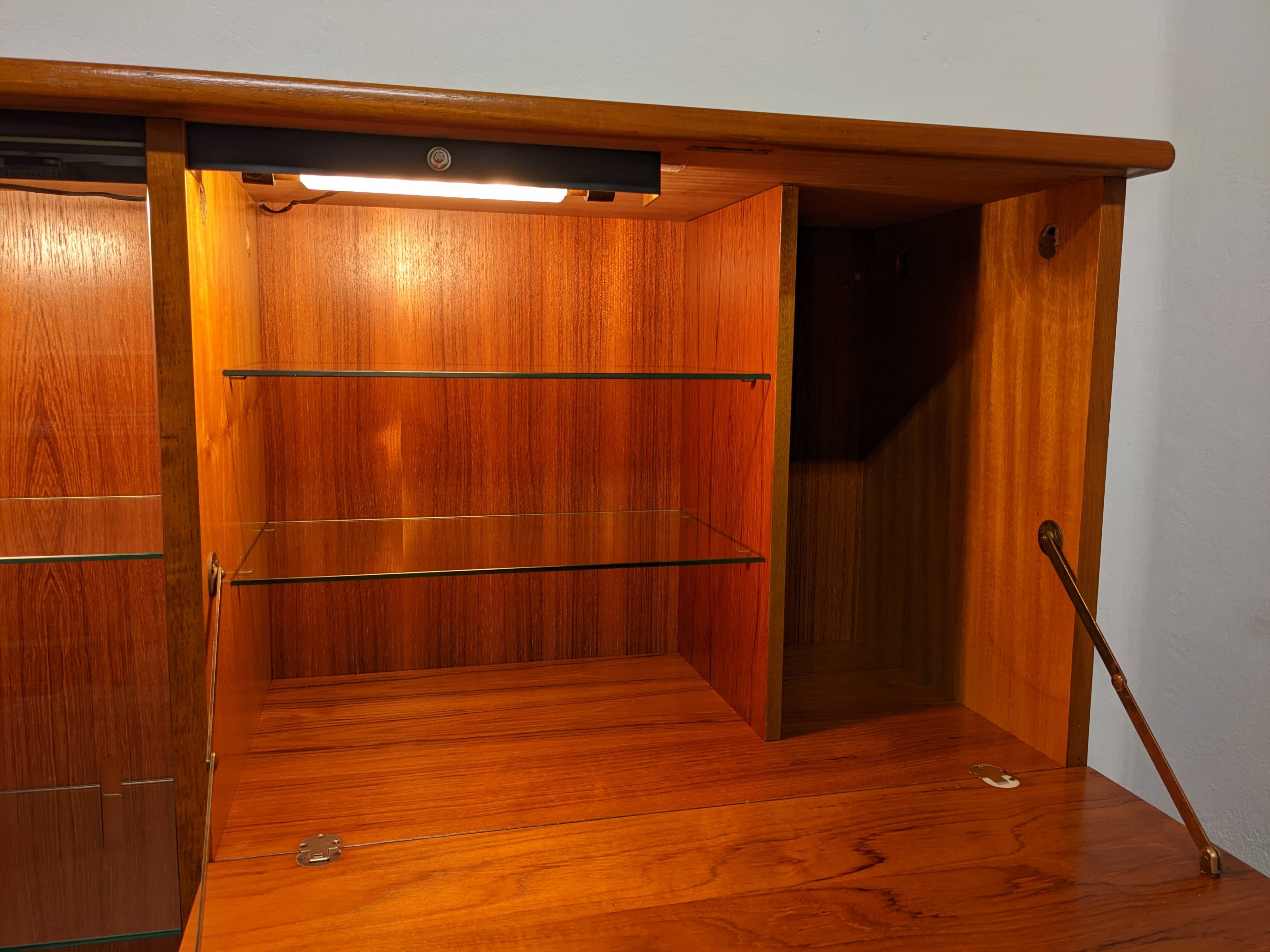 High sideboard, display cabinet and secretary, Scandinavian in teak, France around 1960.
