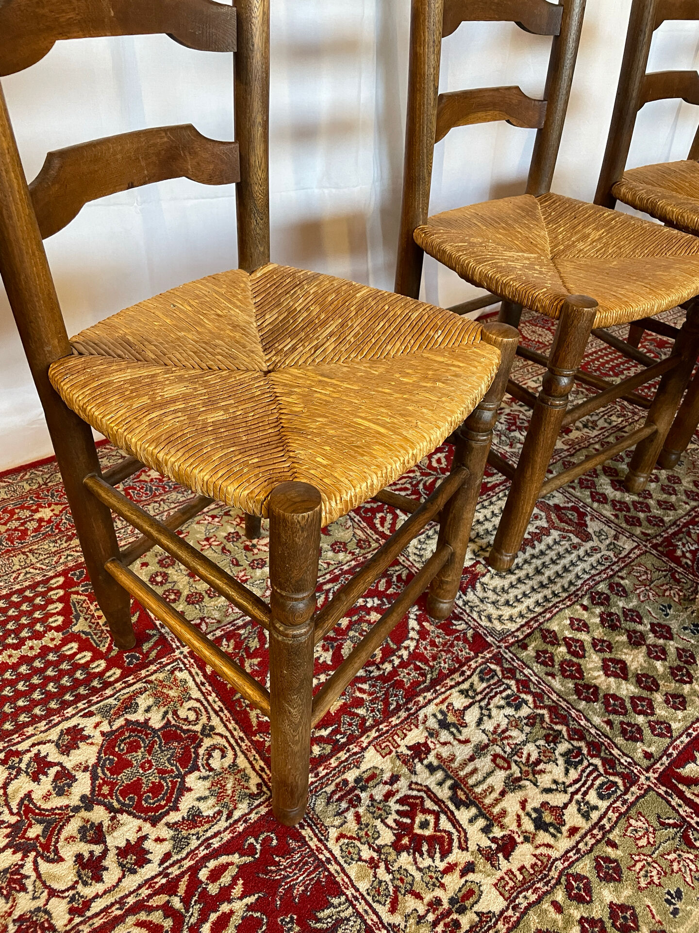 Set of 5 antique oak and straw chairs.