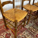 Set of 5 antique oak and straw chairs.