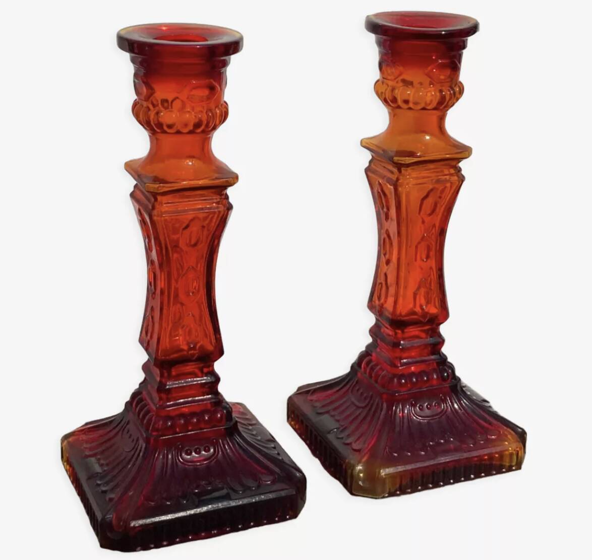 Pair of amber glass candlesticks