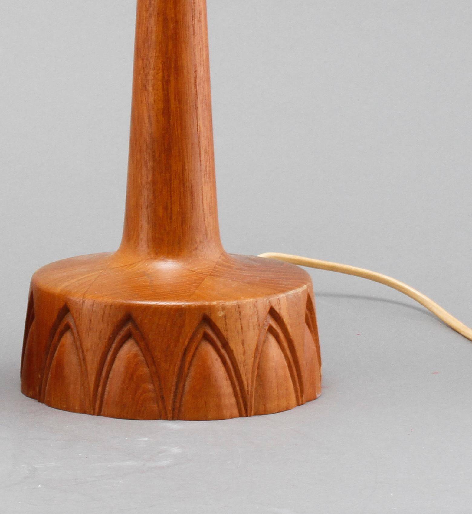 Sculpted teak table lamps for Ab Stilarmatur Tranas, Sweden, 1960.