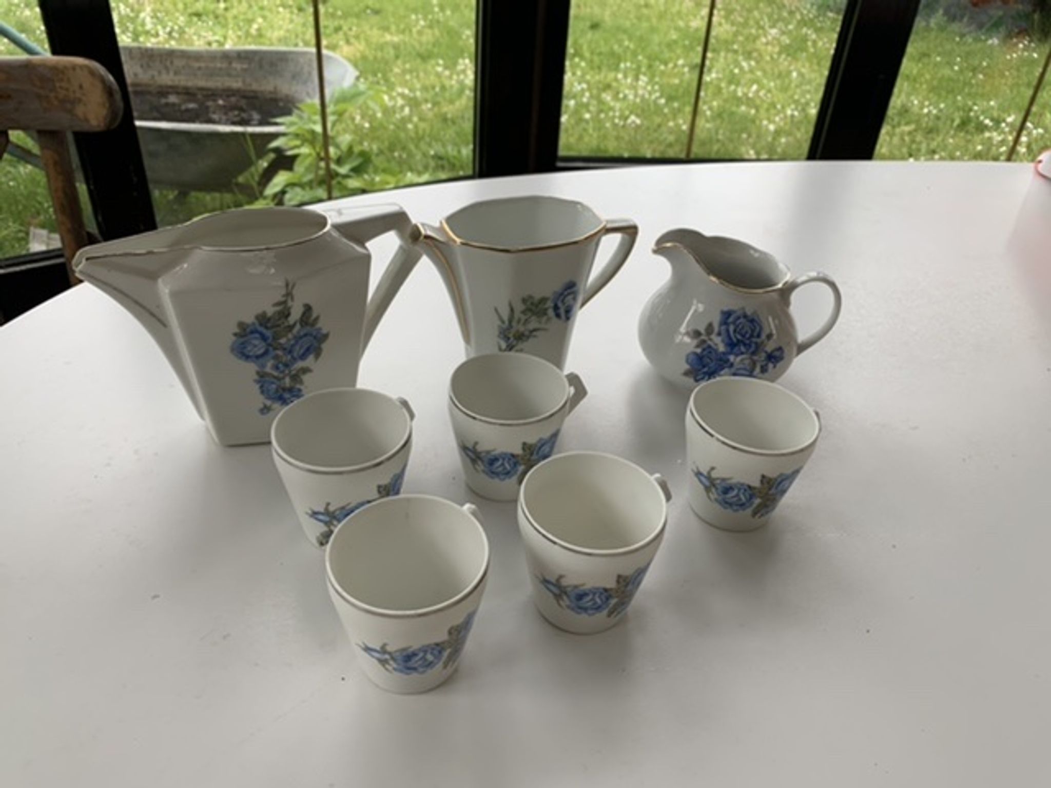 Coffee service in white porcelain pattern pink blue art deco