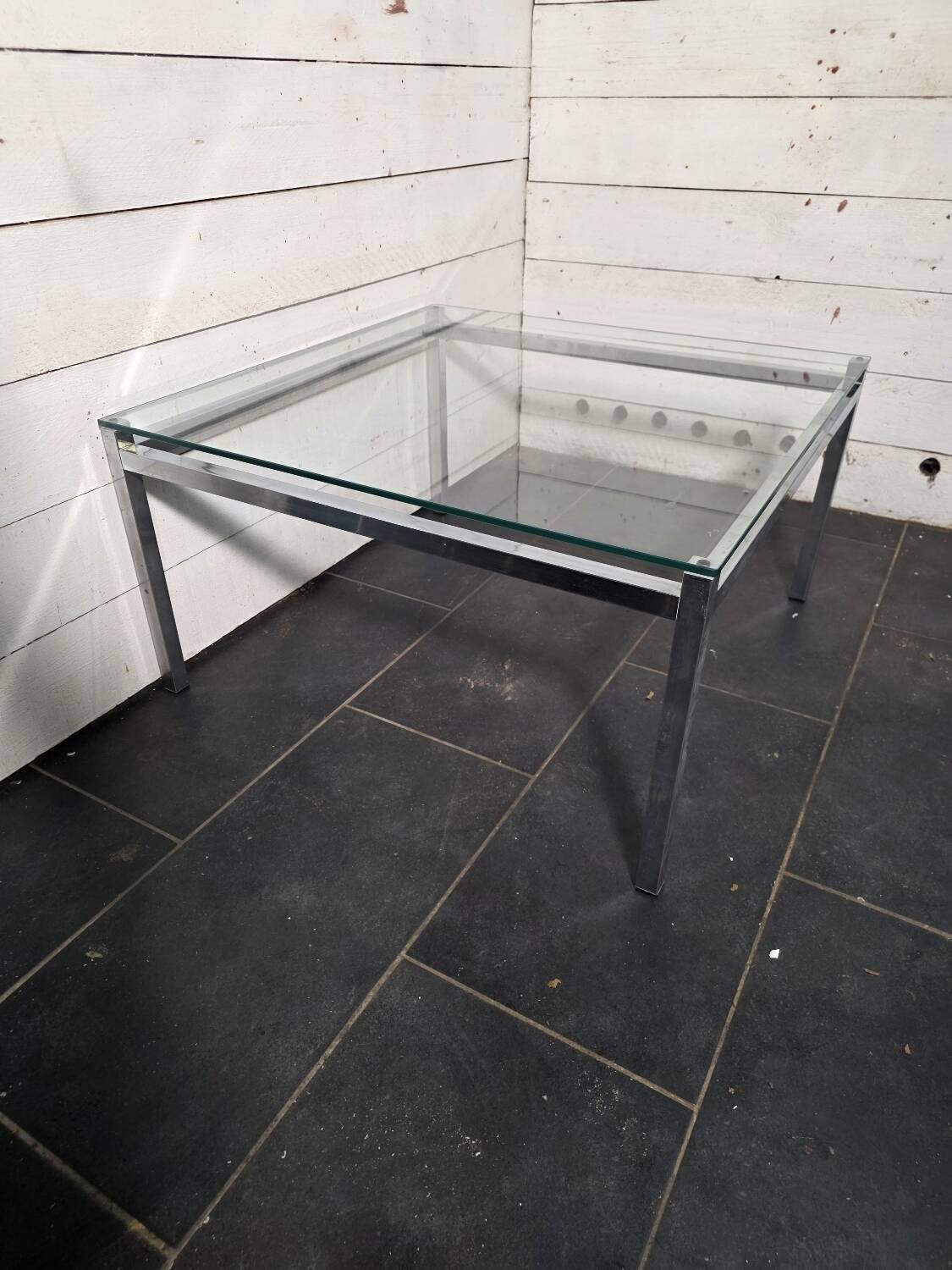 Chrome metal coffee table with a glass top from the 1970s.