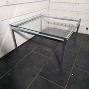 Chrome metal coffee table with a glass top from the 1970s.