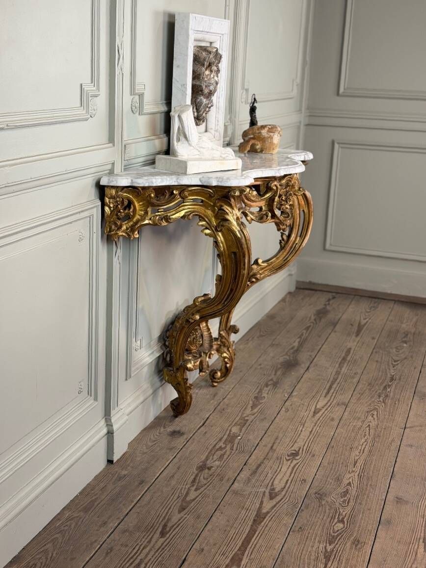 Louis XV style console in carved and gilded wood, circa 1880.