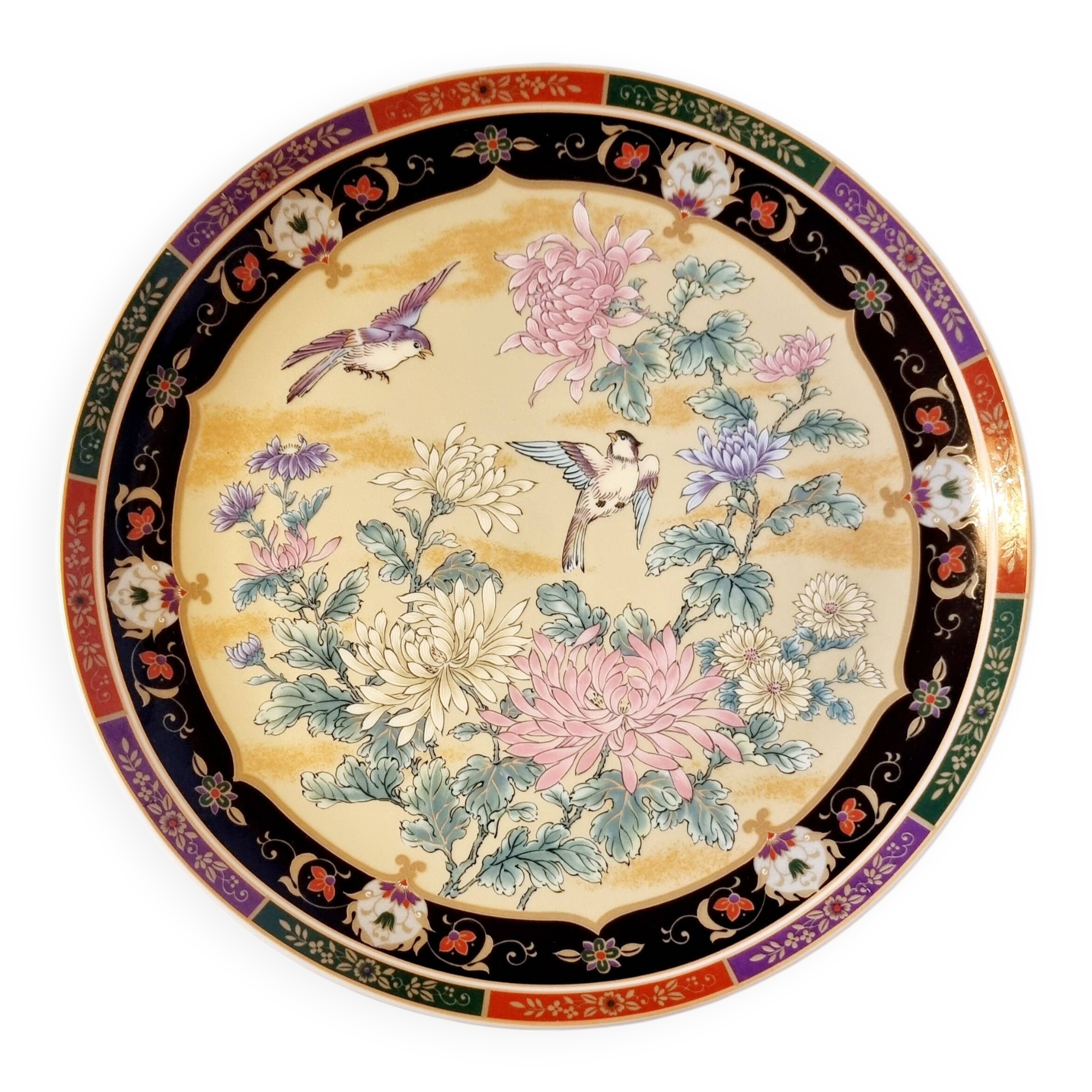 Vintage Japanese decorative plate with chrysanthemum and bird patterns.