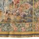 Wall tapestry featuring a pastoral scene.