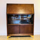 Solid oak secretary with golden feet