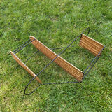 Wall shelf made of rattan and wrought iron