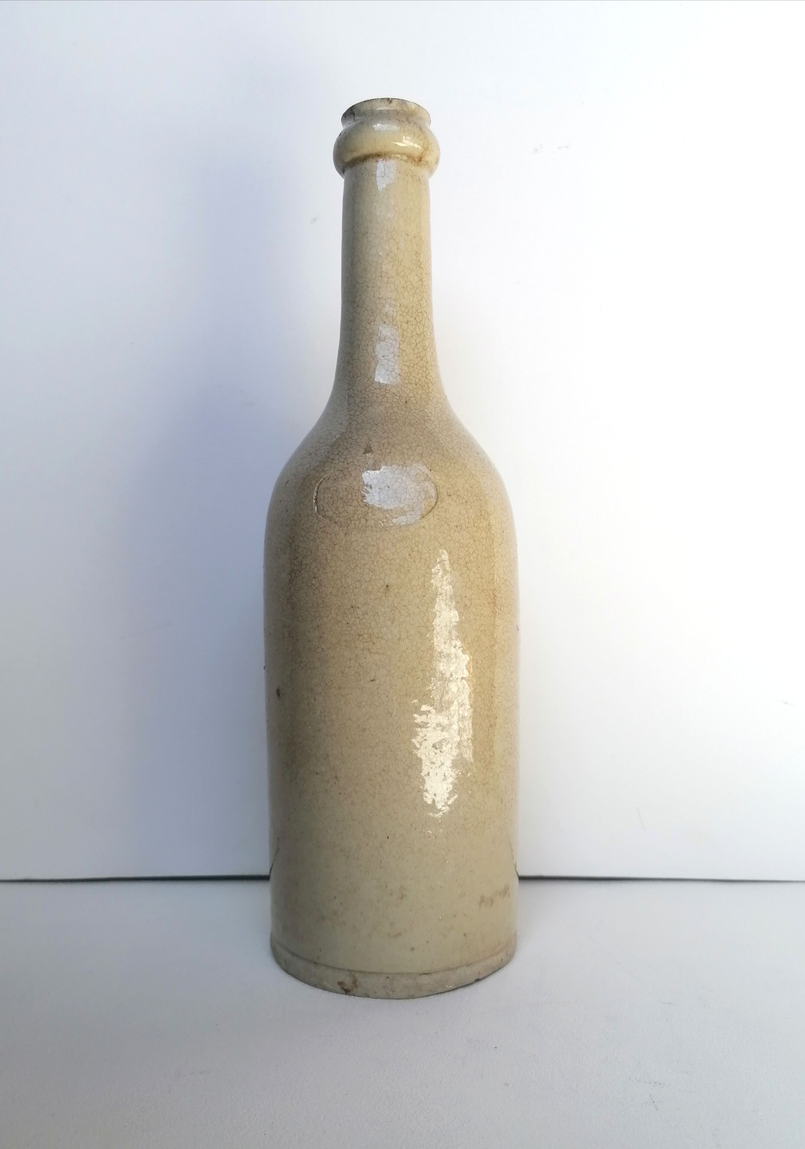 Cracked enamelled sandstone bottle