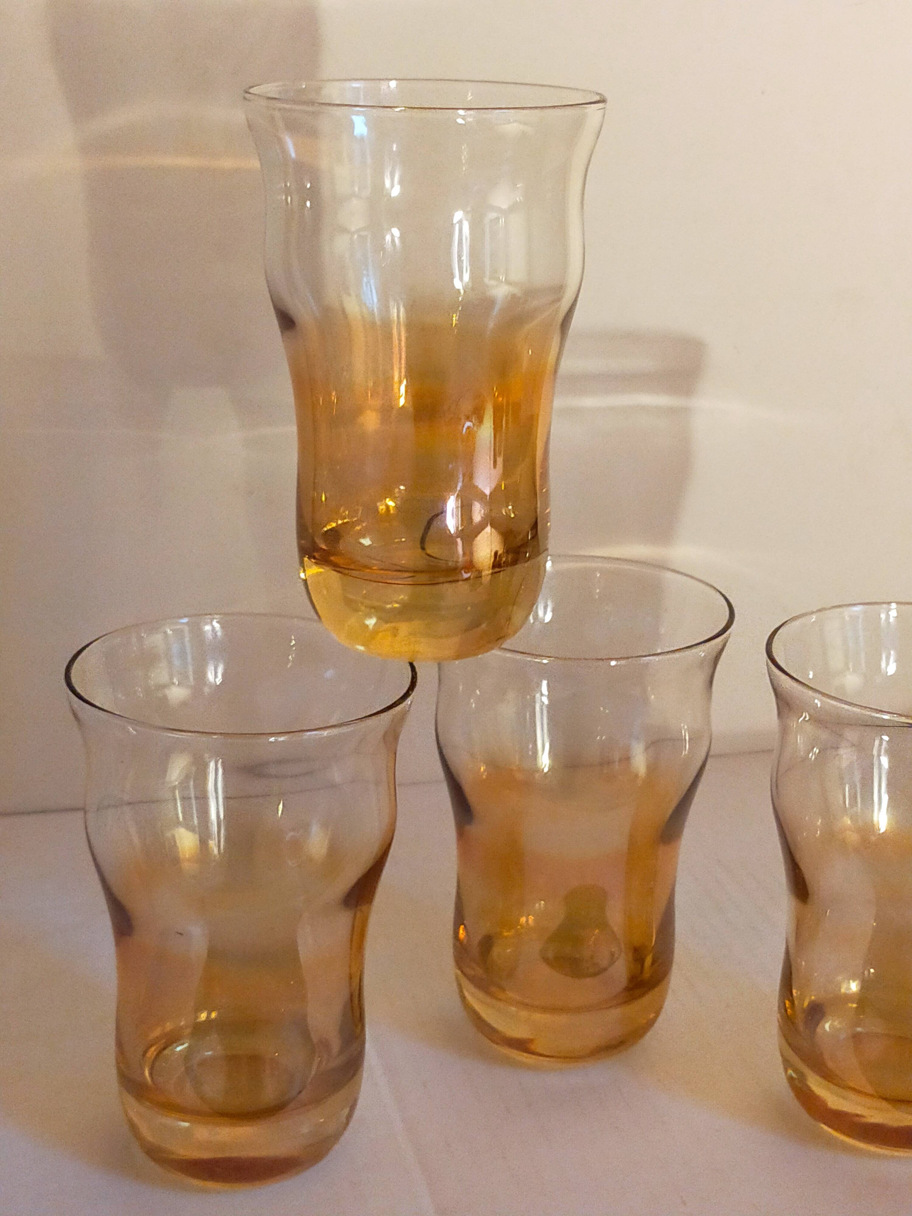 Four iridescent honey blown glass glasses