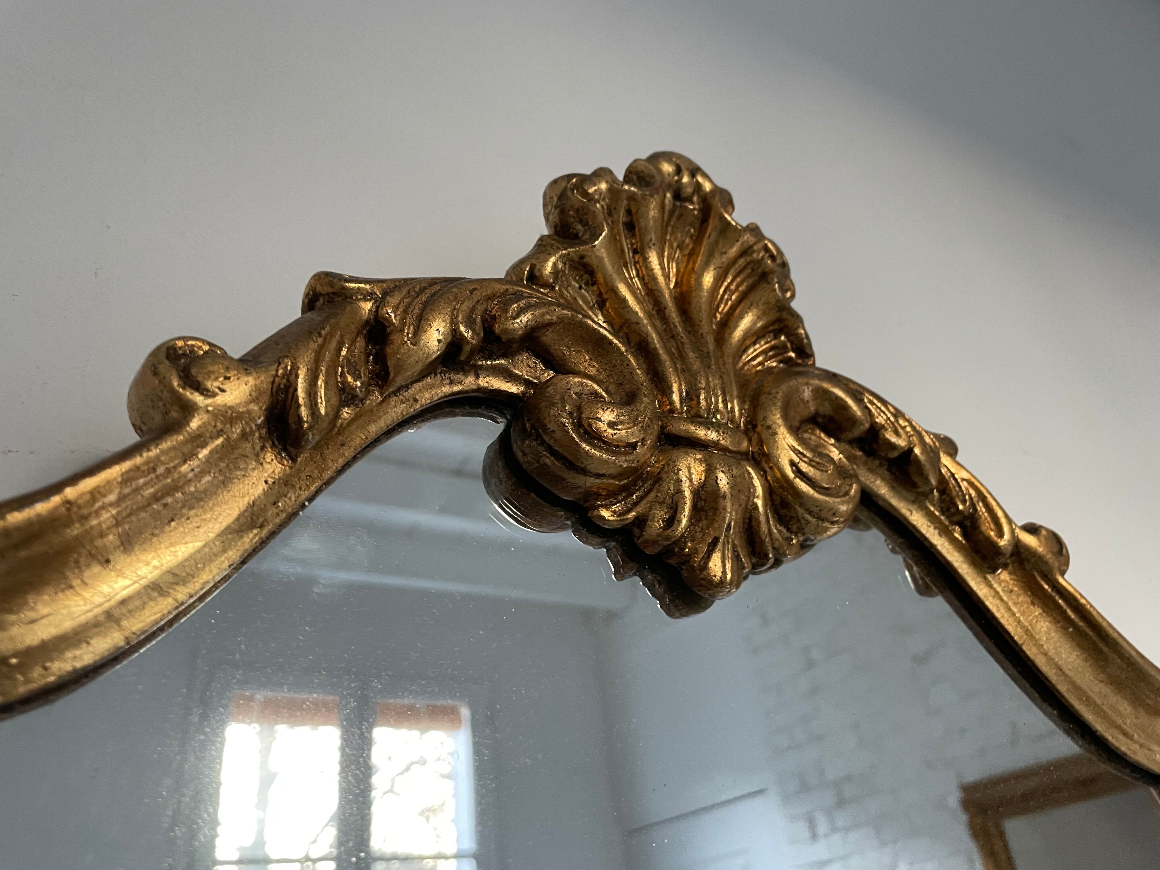 Golden rococo mirror with gold leaf
