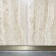 Dining table in travertine and brass. French work. Around 1970.