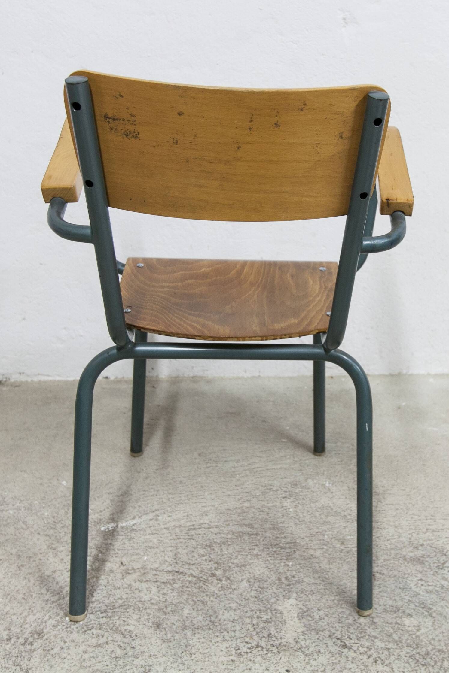 1962 school teacher's chair in honey color and tubular structure