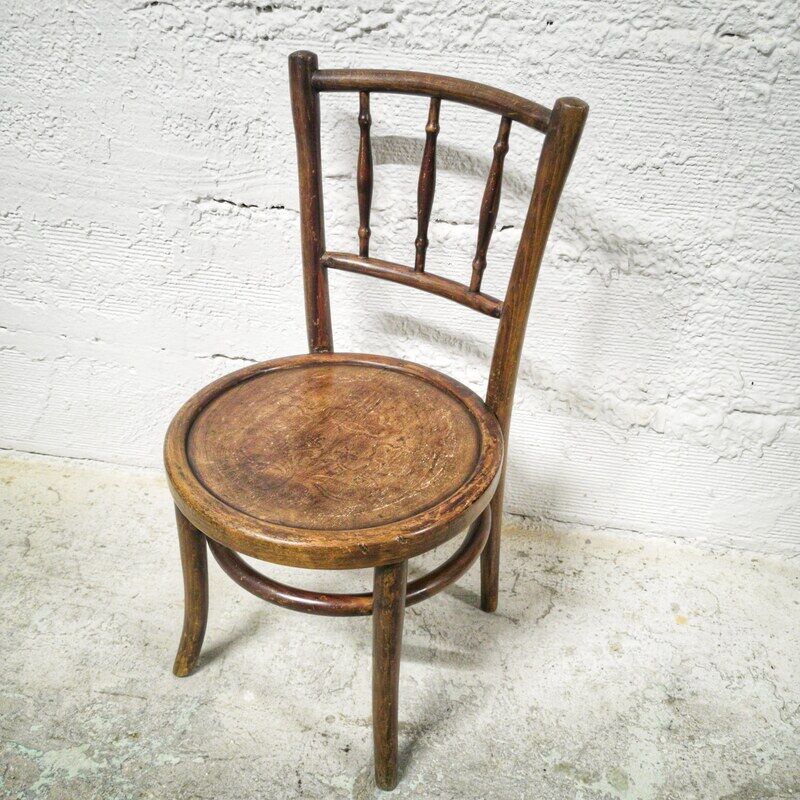 Antique children's chair in curved wood