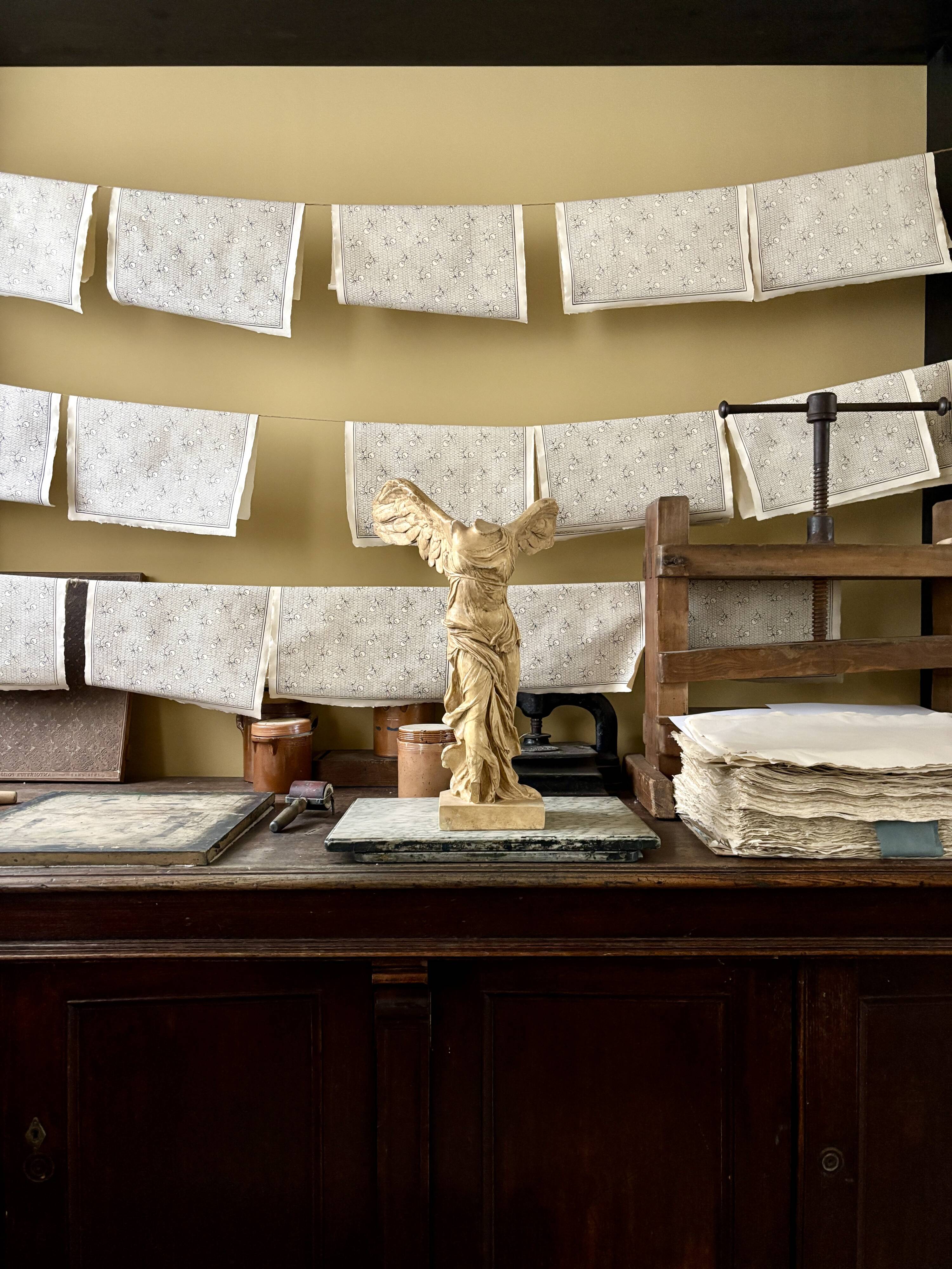 "Winged Victory of Samothrace", beige plaster statuette