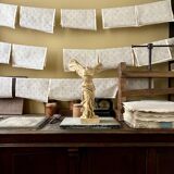 "Winged Victory of Samothrace", beige plaster statuette