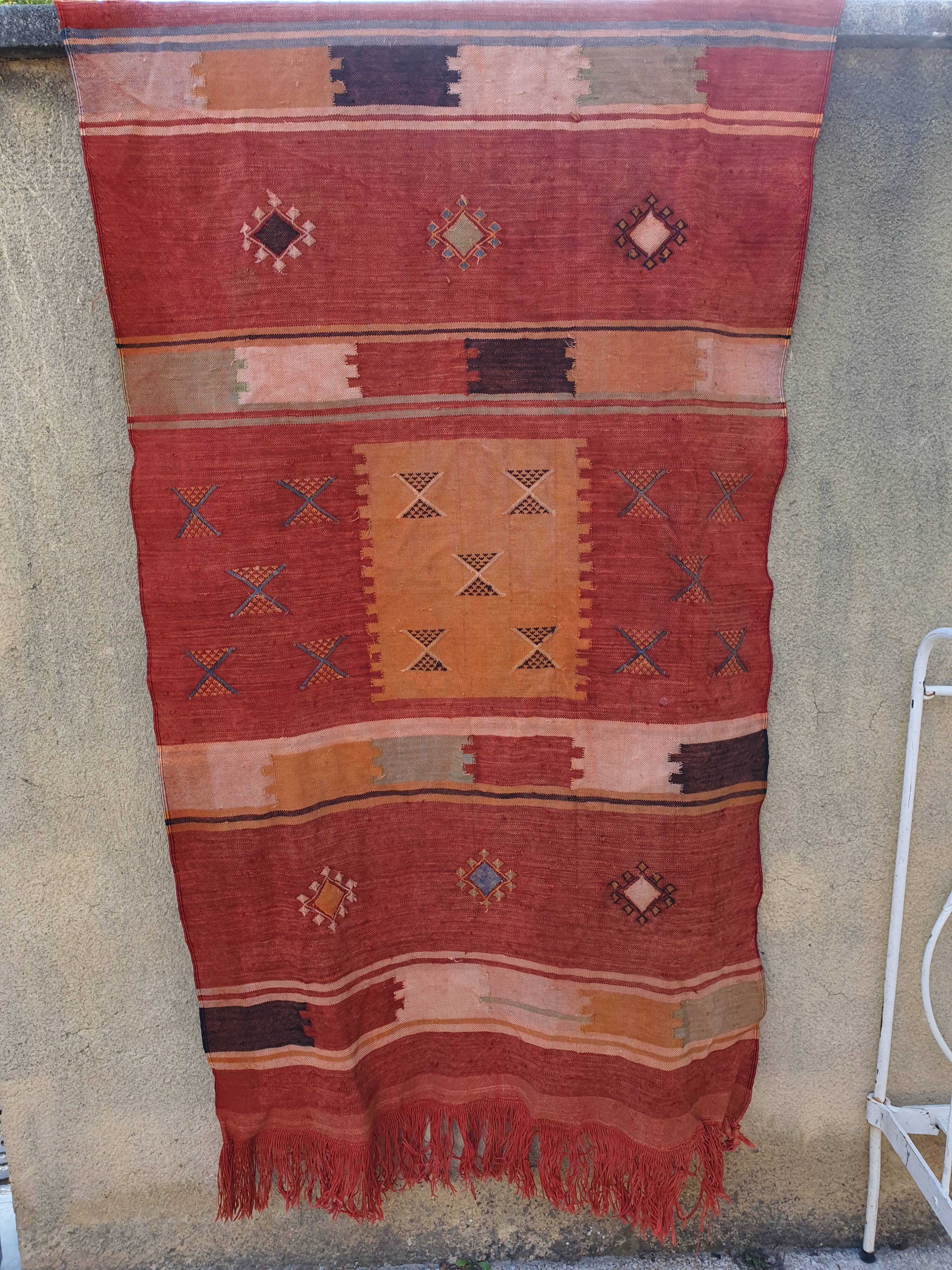 Orange red ethnic carpet 140x82 cm
