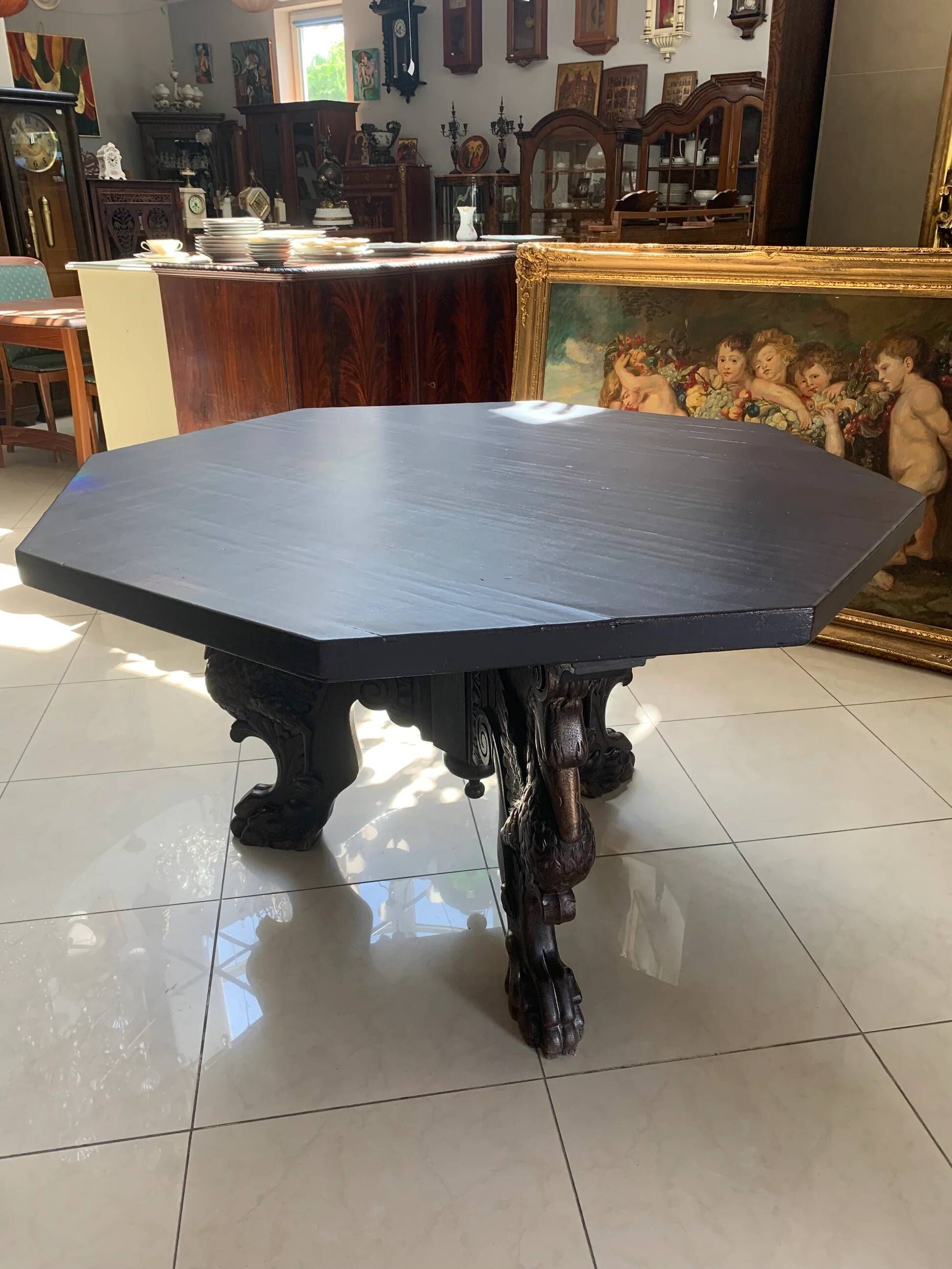 Octagonal oak table, 19th century, with griffins.