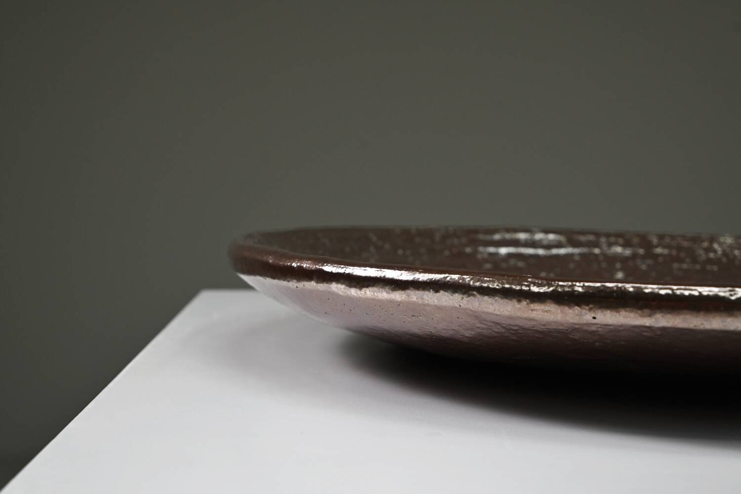 Large handmade metallic glazed ceramic bowl, circa 1980s–1990s.