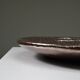 Large handmade metallic glazed ceramic bowl, circa 1980s–1990s.
