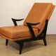 Paire de fauteuils vintage années 50 en bois noir et cuir caramel