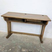 Double school desk and its wooden bench